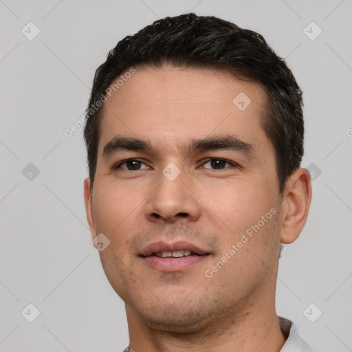 Joyful white young-adult male with short  black hair and brown eyes