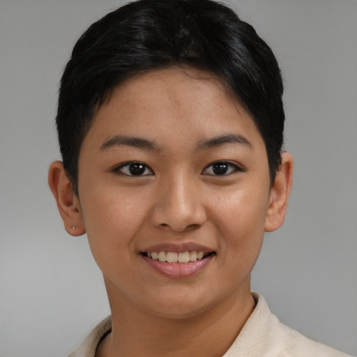 Joyful asian young-adult female with short  black hair and brown eyes