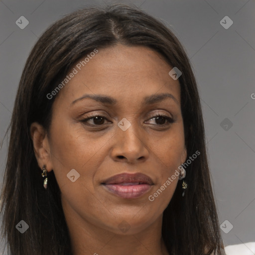 Joyful black young-adult female with long  brown hair and brown eyes