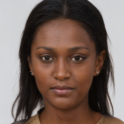 Neutral black young-adult female with long  brown hair and brown eyes