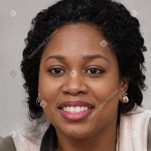 Joyful black young-adult female with long  black hair and brown eyes