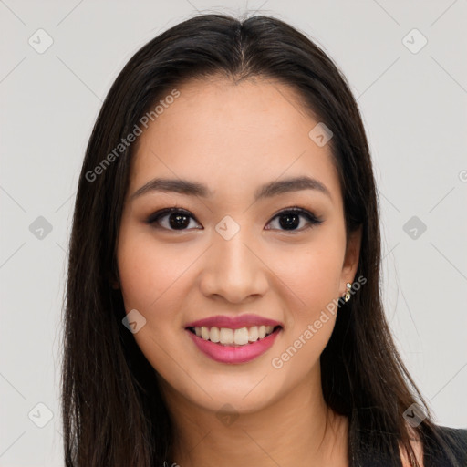 Joyful asian young-adult female with long  brown hair and brown eyes