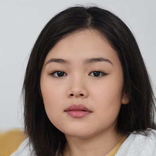 Neutral asian child female with medium  brown hair and brown eyes