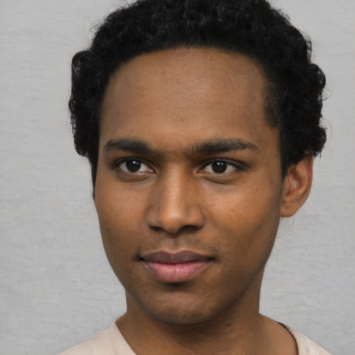 Neutral black young-adult male with short  black hair and brown eyes