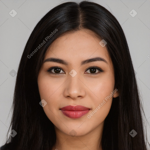 Joyful latino young-adult female with long  black hair and brown eyes