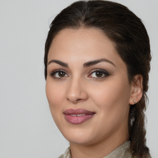 Joyful white young-adult female with medium  brown hair and brown eyes