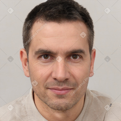 Joyful white adult male with short  brown hair and brown eyes