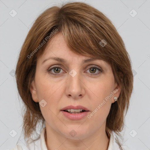 Joyful white adult female with medium  brown hair and grey eyes