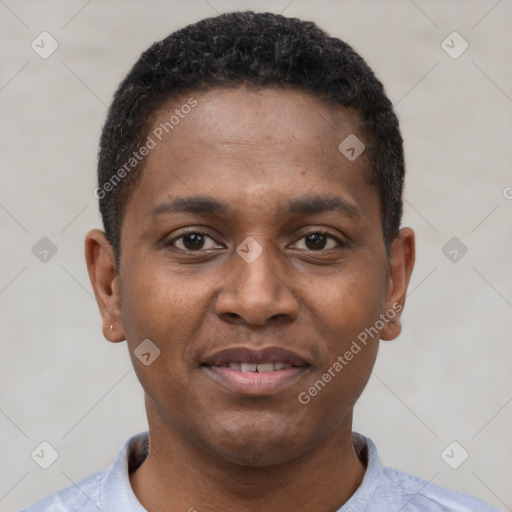 Joyful black young-adult male with short  black hair and brown eyes