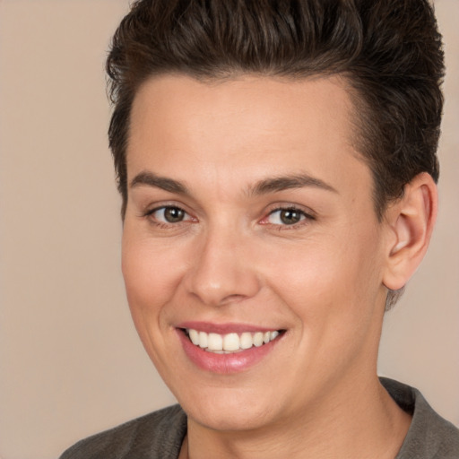 Joyful white young-adult female with short  brown hair and brown eyes