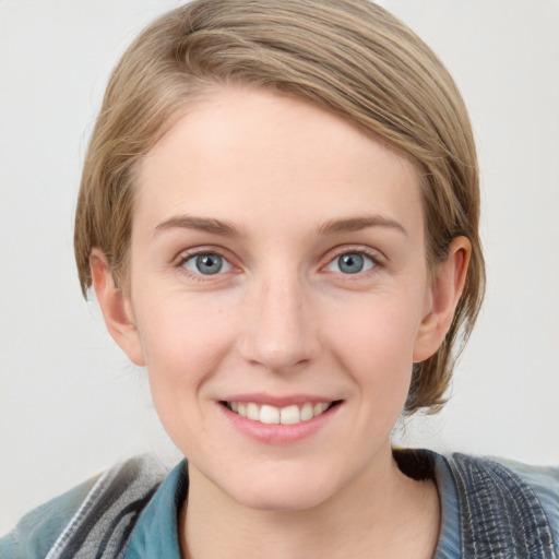 Joyful white young-adult female with medium  brown hair and blue eyes