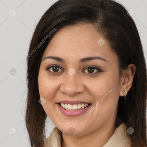 Joyful latino young-adult female with long  brown hair and brown eyes