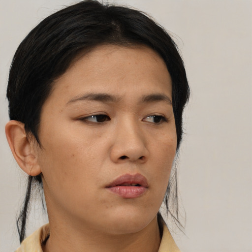 Neutral asian young-adult female with medium  brown hair and brown eyes