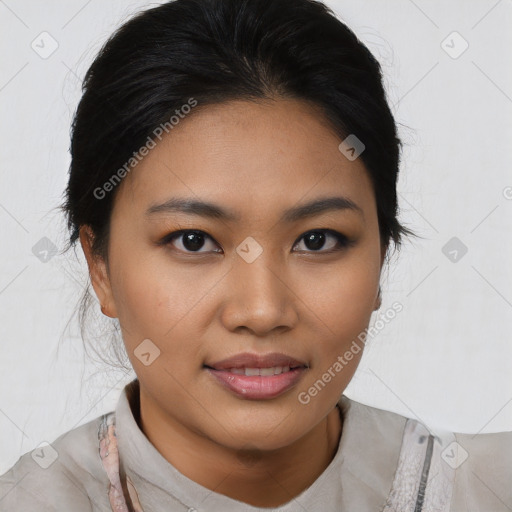 Joyful asian young-adult female with medium  black hair and brown eyes