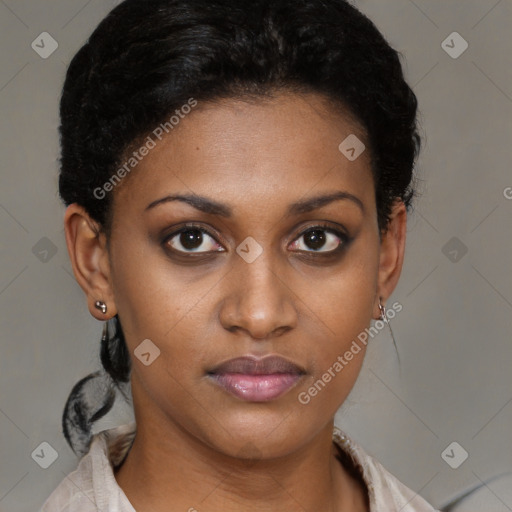 Joyful black young-adult female with short  brown hair and brown eyes