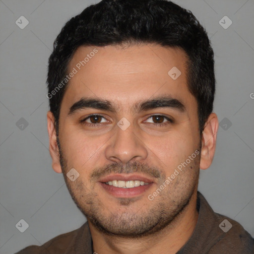 Joyful white young-adult male with short  black hair and brown eyes