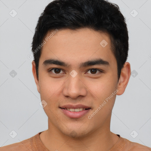 Joyful white young-adult male with short  black hair and brown eyes