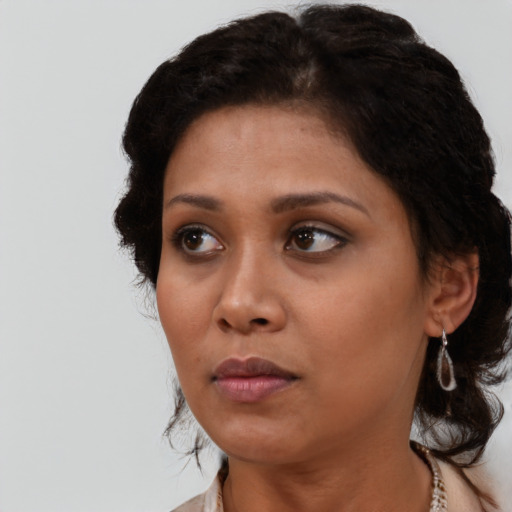 Neutral black young-adult female with short  brown hair and brown eyes