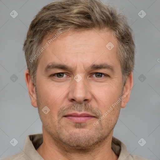 Neutral white adult male with short  brown hair and grey eyes