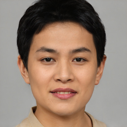 Joyful asian young-adult male with short  brown hair and brown eyes
