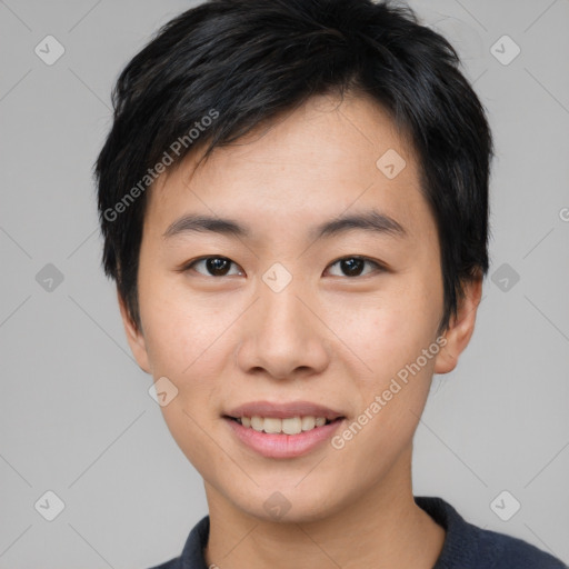 Joyful asian young-adult male with short  black hair and brown eyes