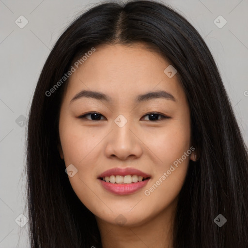 Joyful asian young-adult female with long  brown hair and brown eyes