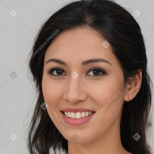 Joyful asian young-adult female with long  brown hair and brown eyes