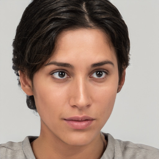 Neutral white young-adult female with short  brown hair and brown eyes