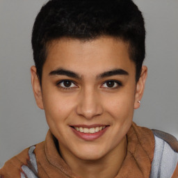 Joyful latino young-adult male with short  brown hair and brown eyes