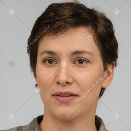 Joyful white adult female with short  brown hair and brown eyes