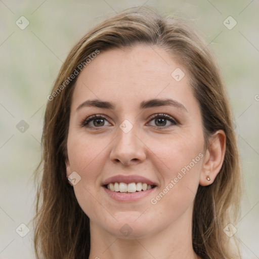 Joyful white young-adult female with medium  brown hair and green eyes