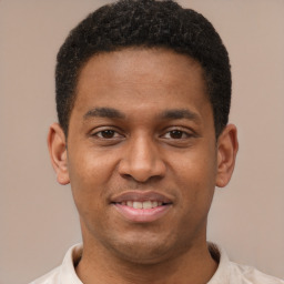 Joyful latino young-adult male with short  brown hair and brown eyes