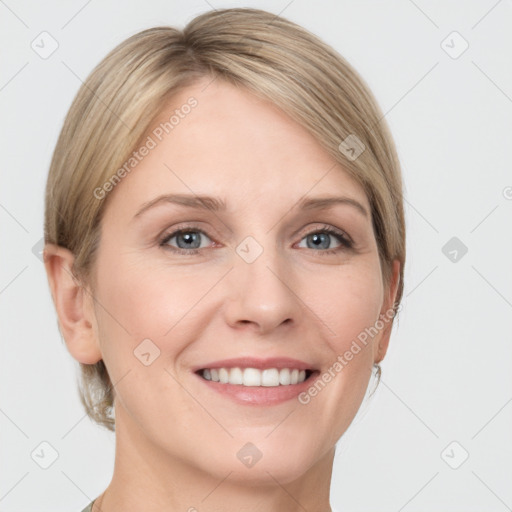 Joyful white young-adult female with medium  brown hair and grey eyes