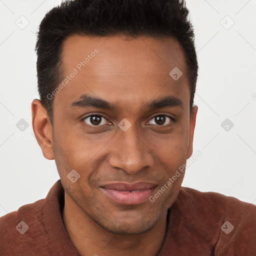 Joyful black young-adult male with short  brown hair and brown eyes