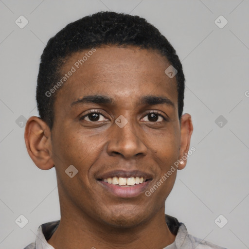 Joyful black young-adult male with short  black hair and brown eyes