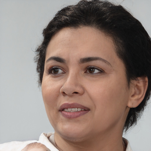 Joyful white adult female with short  brown hair and brown eyes