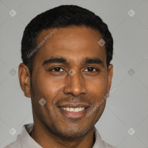 Joyful black young-adult male with short  black hair and brown eyes