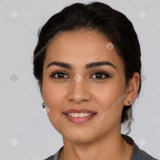 Joyful latino young-adult female with long  brown hair and brown eyes