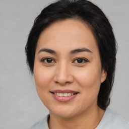 Joyful asian young-adult female with medium  brown hair and brown eyes