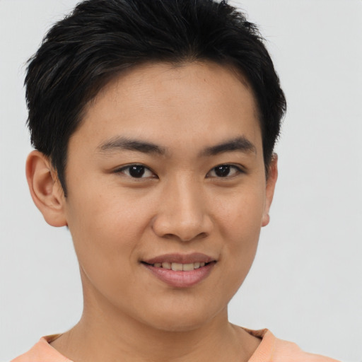 Joyful asian young-adult male with short  brown hair and brown eyes