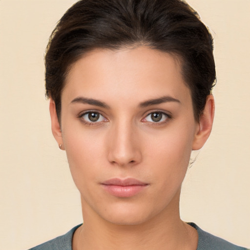 Neutral white young-adult female with short  brown hair and brown eyes