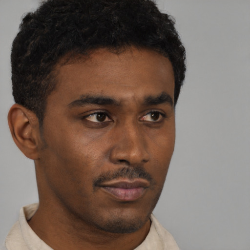 Neutral black young-adult male with short  brown hair and brown eyes