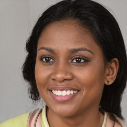 Joyful black young-adult female with medium  brown hair and brown eyes