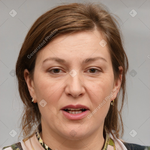 Joyful white adult female with medium  brown hair and grey eyes