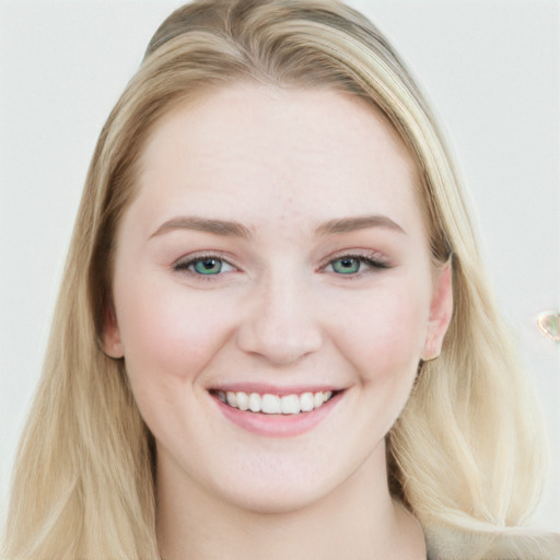 Joyful white young-adult female with long  brown hair and blue eyes