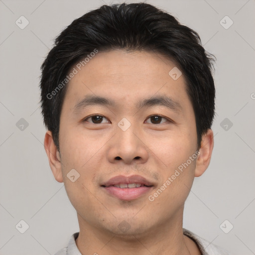 Joyful asian young-adult male with short  black hair and brown eyes