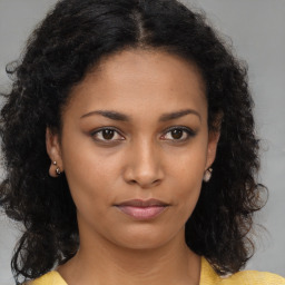 Neutral black young-adult female with medium  brown hair and brown eyes