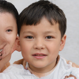 Joyful white child male with short  brown hair and brown eyes