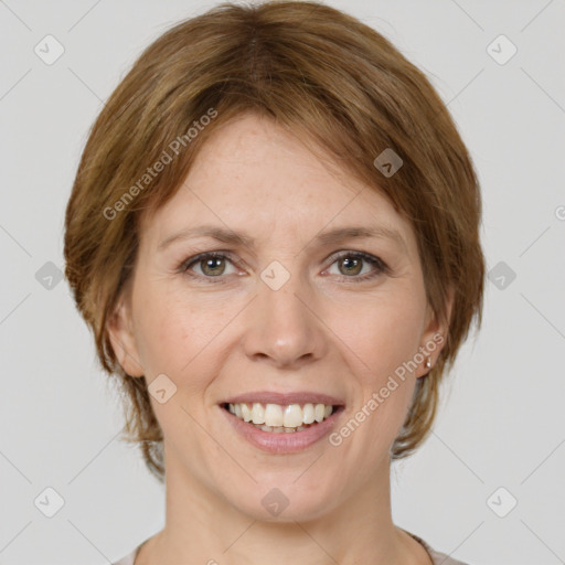 Joyful white adult female with medium  brown hair and grey eyes