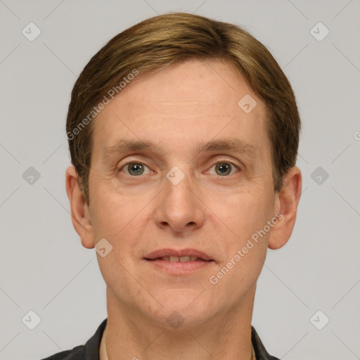 Joyful white adult male with short  brown hair and grey eyes